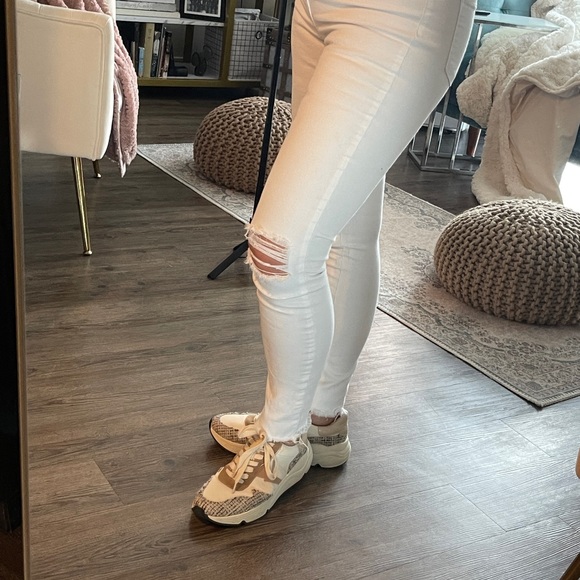 White skinny jeans with stretch and slightly distressed.  Never been worn. 27 - Picture 10 of 10